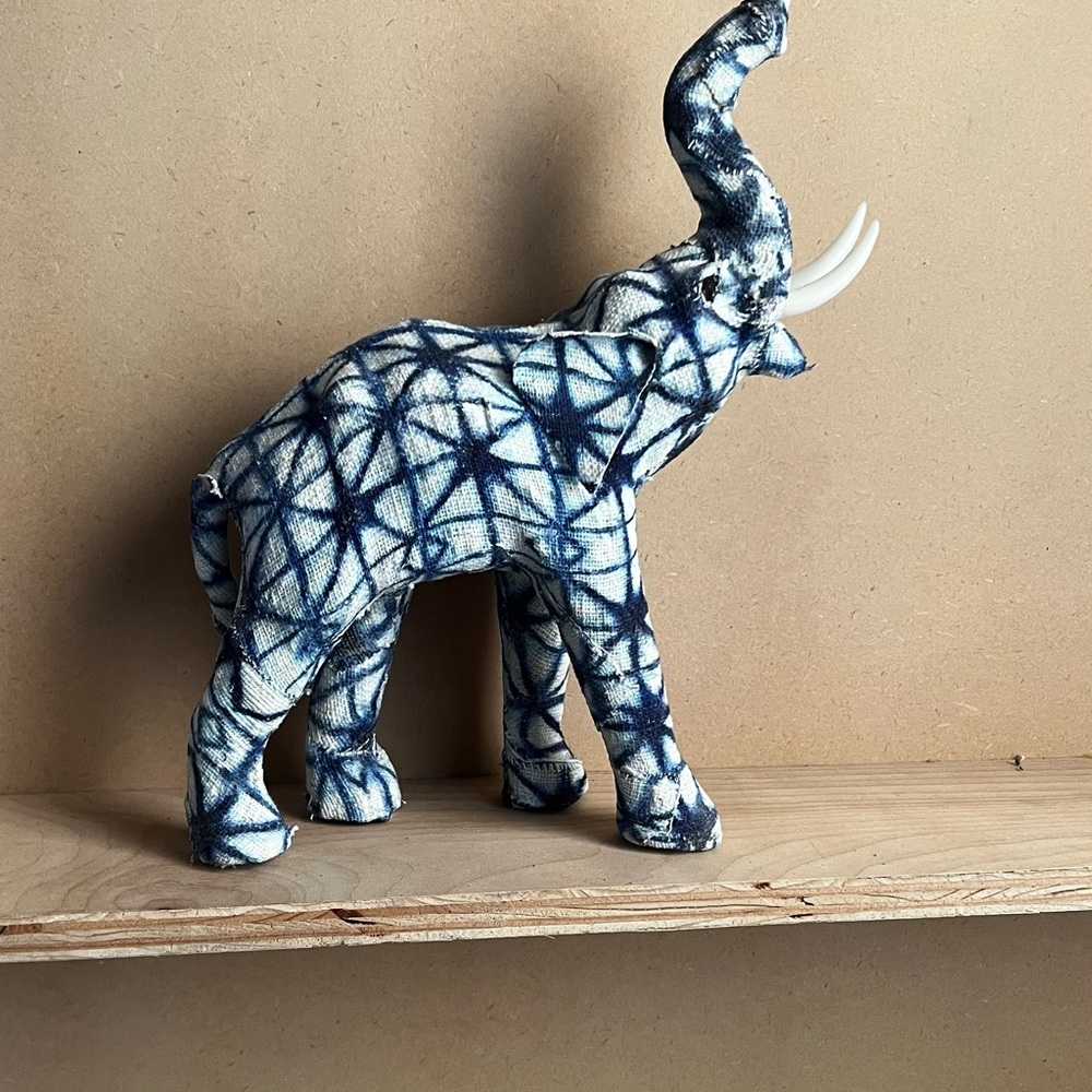 Elephant with trunk up! Ready for a perfect home!